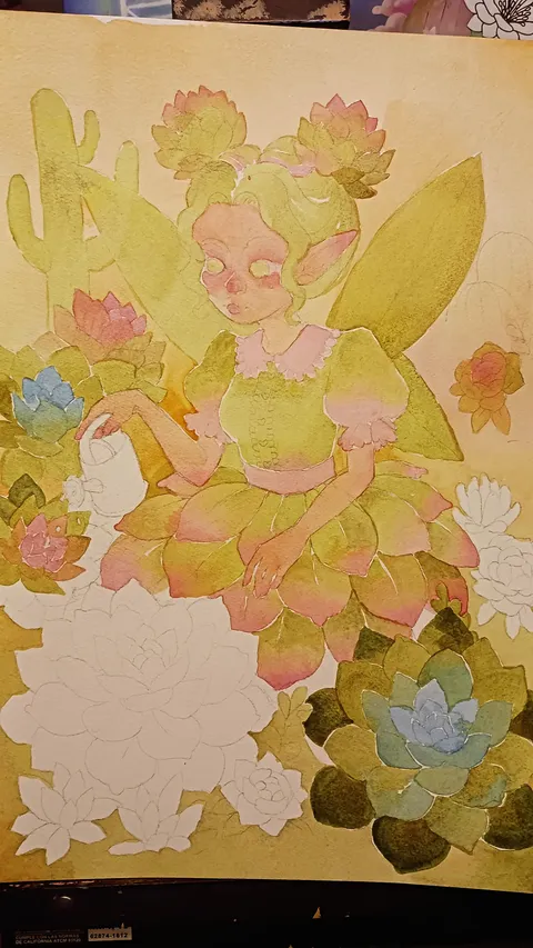 Work‑in‑progress illustration of a succulent fairy. The fairy’s wings, face, and parts of her dress are colored, while many surrounding succulents remain uncolored or lightly shaded. The scene includes cacti and rosette succulents in a desert‑like setting.