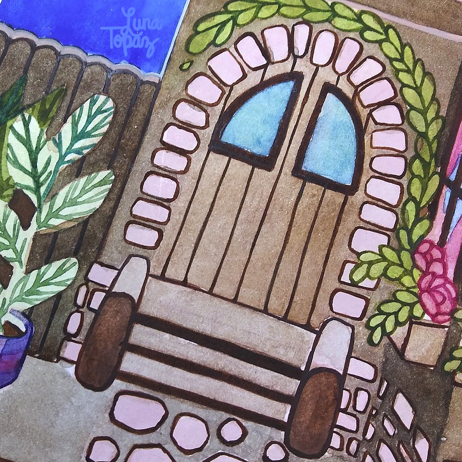 A close‑up of Luna Topaz’s "Spring Vibes" watercolor painting showing a wooden arched door framed by light stonework and green vines. Pink flowers bloom under the window above, and leafy plants surround the doorway, creating a cozy, welcoming atmosphere.

